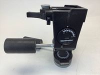 Close-up photo of the Manfrotto #29 tripod head showing the handle, angle markings, adjustment knobs, and the missing quick release plate slot.