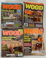 Four Wood Magazine issues spread side by side, showing covers with woodworking projects and tips.