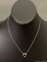 Full necklace displayed on bust showing overall design and chain length