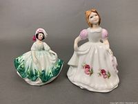 Both Royal Doulton figurines side by side showing scale and detail