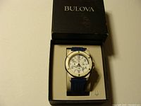 Watch with blue rubber strap inside Bulova box