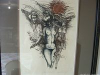 Full view of the framed numbered limited edition print showing three nude female figures in a surreal composition, under glass with matte.
