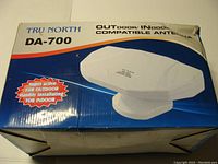 Box of TRU North DA-700 antenna indicating outdoor/indoor compatibility and details about installation and gain.