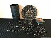 Photo showing the large glass vase, mosaic glass plate, three tealight holders, ceramic plant holder, metal and glass sun catcher, and two beaded decorative strings.