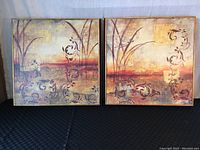 Front view of two large framed abstract prints side by side, showing full artwork and frame detail.