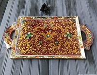 Top view of the rectangular serving tray showing the ornate bird and floral hand-painted design under glass.
