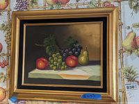 Canvas wall art featuring fruit still life in gilded frame.