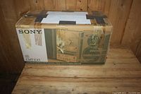 Sony CMT-EX1 CD Desktop Micro Hi-Fi System original box showing the system features and brand.