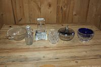 Wide shot of all six crystal items on wooden surface.