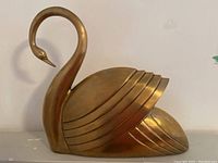 Front view of the entire brass swan sculpture