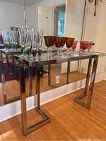 Console table against mirrored wall displaying full front view