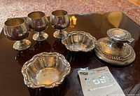 Overall view showing all pieces: inkwell, three cups, two dishes