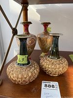 All four vases displayed, showing size difference and detailed metal overlay