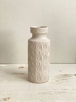 Front view of the white embossed onion pattern ceramic vase showing full profile with visible raised textures