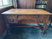 Front view showing full desk and carved apron