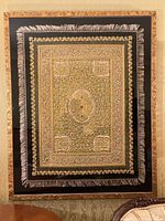 Full frontal view of framed carpet hanging on wall