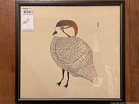 Full view of framed print hanging on wall, showing overall appearance