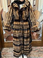 Front view of coat on model showing length, collar, stripe pattern