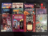 Photo showing 12 comic books in excellent condition including Power Girl, Batgirl, Wolverine & The X-Men Deadpool and others
