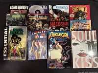 Photo showing 12 comic books including Bomb Queen, Wonder Woman, She-Hulk, Jungle Girl, Captain America, Teen Titans and others arranged side by side.