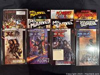 Front view of 12 Marvel comic books, including Ms. Marvel, X-Men, The Ultimates, Weapon X and others in excellent like-new condition.