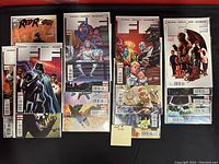 Photo of 20 comics including Red Robin, multiple Fantastic Four issues, and other titles. Comics are bagged and boarded, arranged in four stacks.