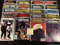 Photo showing 20 comic books including Nightwing, Gotham Central, Batman, and Outlaw Central series all bagged and boarded in high grade condition.