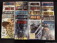 20 bagged and boarded Jonah Hex comics arranged in four columns of five each, showing variety of cover designs and vibrant colors.