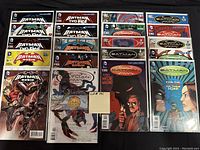 Photo showing 20 Batman-related comics in bagged and boarded condition, arranged in three rows. Covers prominently feature Batman, Robin, and Two-Face characters.