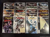 Photo showing 20 Batman Eternal comics arranged in four rows, all bagged and boarded, featuring various cover arts including Catwoman, Batgirl, Penguin, and other Batman characters.