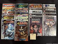 Photo of 20 comic books from Justice League, Forever Evil A.R.G.U.S., Punisher War Journal, and The Initiative series, all bagged and boarded.