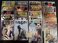 Photo shows 20 comics bagged and boarded, featuring Batman Dark Knight, Nightwing, Superman, X-Men, Gambit, Justice League of America, Generation X series.
