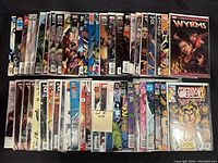 Photo showing 50 comic books arranged in two rows, visible titles including X-Men, X-Factor, Generation X, and Wyrms illustrated covers.