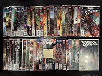 Photo of 50 assorted comic books featuring multiple DC Comics titles in mid to high grade condition