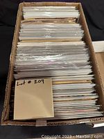 Full view of shortbox filled with bagged comics showing the quantity and storage condition