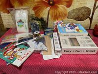 Overview showing Christmas gift bags, ribbons, skewers, crafting supplies in original packaging