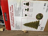 Box showing Ashland brand, Pre-lit Jefferson Tree, 7.5 ft tall, with product details and lighted example image.