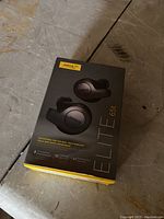 Box for Jabra Elite 65t earbuds headphones showing product image and branding.