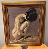 Frontal photo showing the entire needlepoint artwork and gold velour crackle frame, clearly illustrating design and colors.