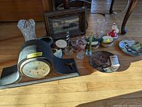 Wide view of entire lot showing mantle clock, vases, plates, figurines and framed picture