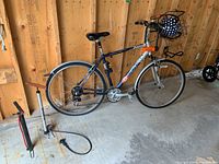 Side view of Fuji Crosstown bicycle showing frame, tires, seat, and basket