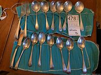 All utensils laid out on felt pouch