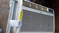 Front view of LG window air conditioner unit showing air vents and model label.