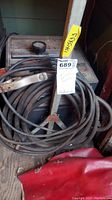 Full view of Craftsman arc welder unit with associated heavy cables and clamp, showing overall condition and dimensions tag.