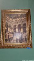 Full view of one framed oil painting showing elaborate staircase interior and crowds of people, framed in ornate gold frame.