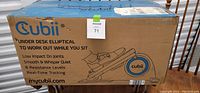 Box front showing Cubii branding and key features of the elliptical: low impact, whisper quiet, 8 resistance levels, real-time tracking.