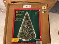 Boxed artificial Christmas tree Holiday Collection Adirondack Pine Tree 6.5 ft with 864 branch tips as shown on packaging front.