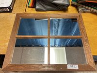 Front view of the wood framed mirror showing the six-panel windowpane style design with visible reflections.