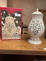 Lenox beverage dispenser 15 inch tall with holly berry decoration on ceramic ceramic body, shown with original box.