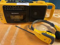 Front view of the yellow Sony Sports cassette recorder with AM/FM radio tuner and speaker.